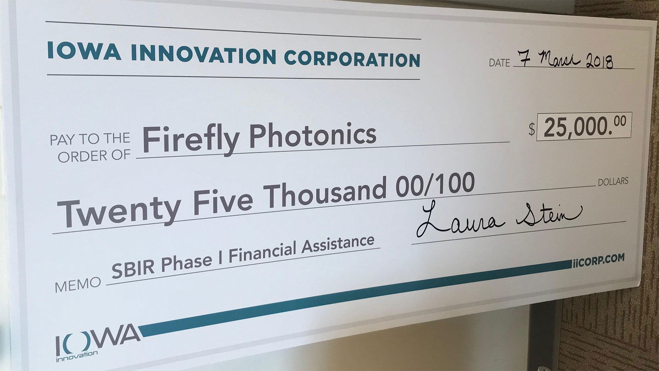 $25000 check to Firefly Photonoics